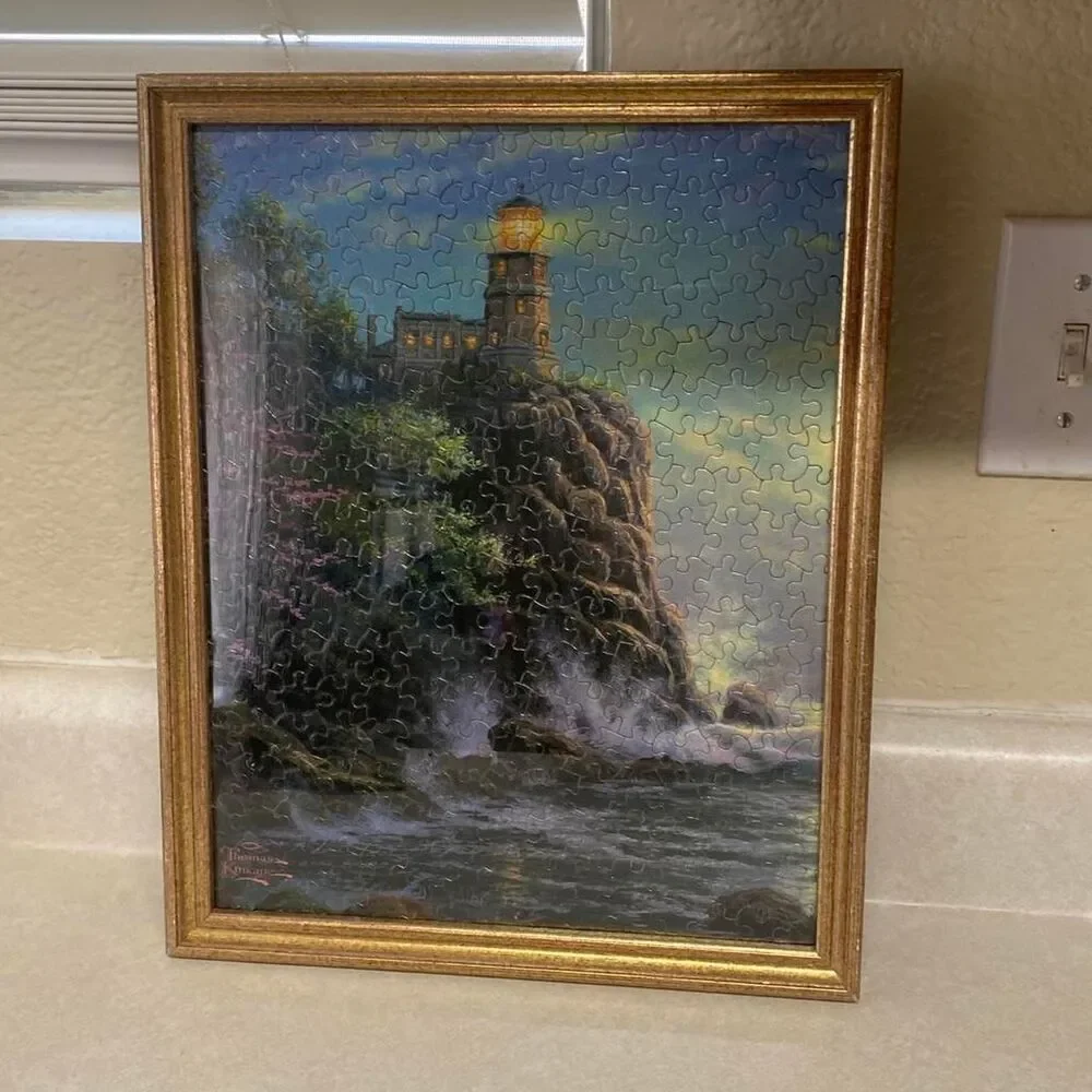 Framed Thomas Kinkade completed puzzle split rock light